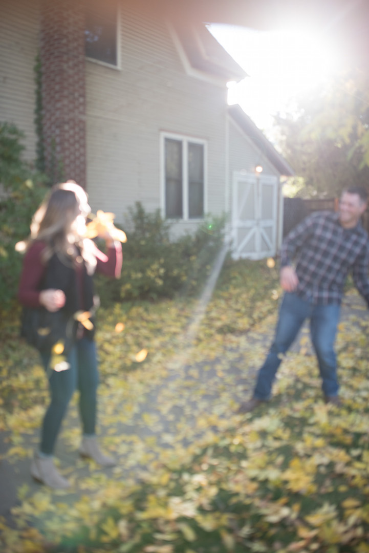 Max and Jenae throwing leaves at each other - blurry