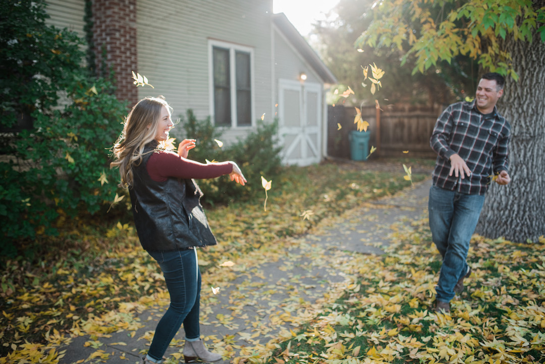 Max and Jenae throwing leaves at each other