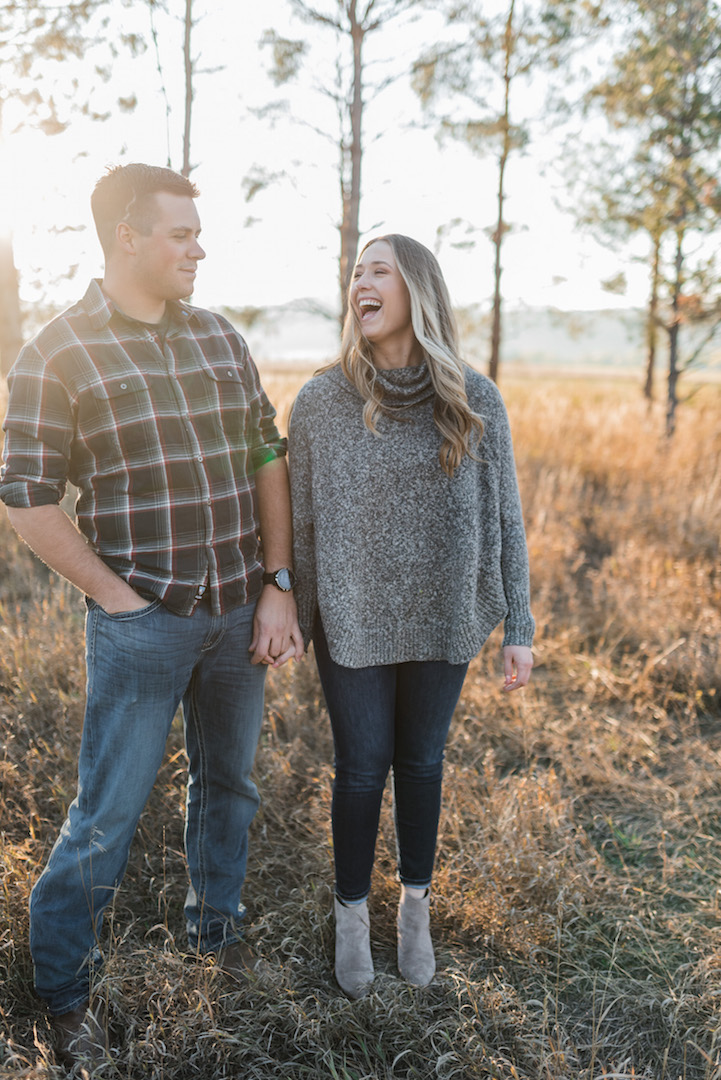 happy fort collins couple during lifestyle photoshoot in a sunny field