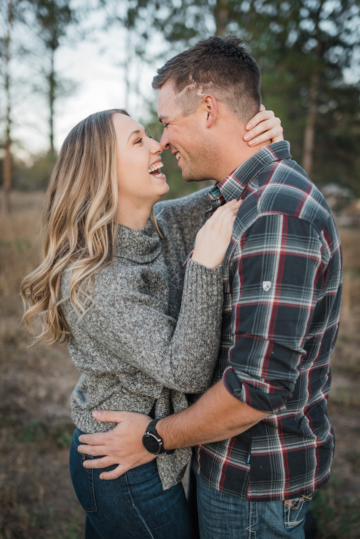 Fort Collins couple smiling and hugging lifestyle photoshoot