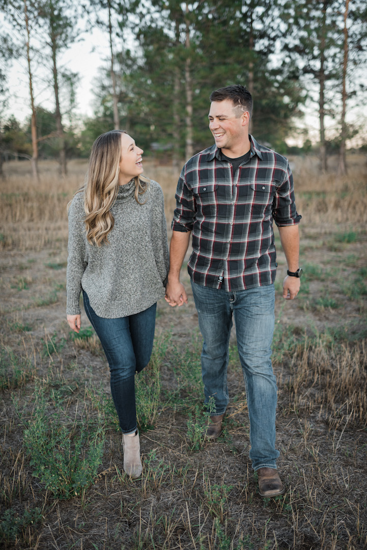 Fort Collins couple holding hands during lifestyle photoshoot