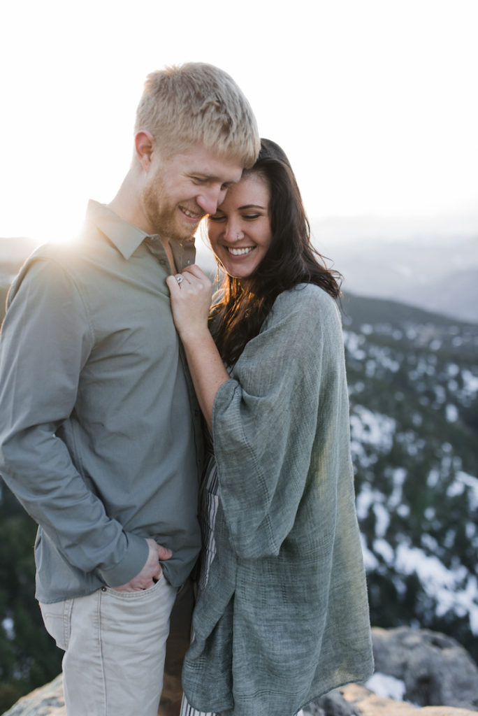 Boulder golden hour engagement with couple laughing
