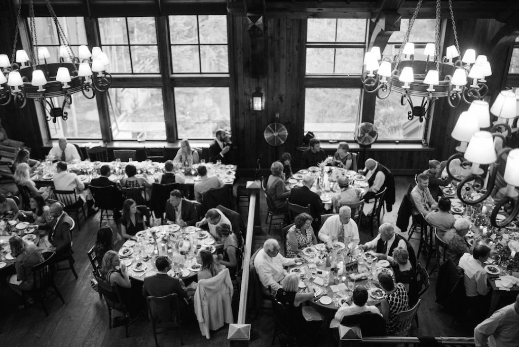 Beaver Creek autumn wedding table with guests eating dinner black and white