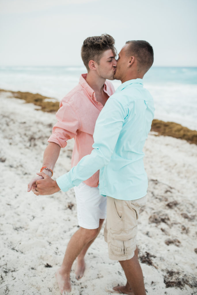 Cancun beach lovers shoot, kissing 