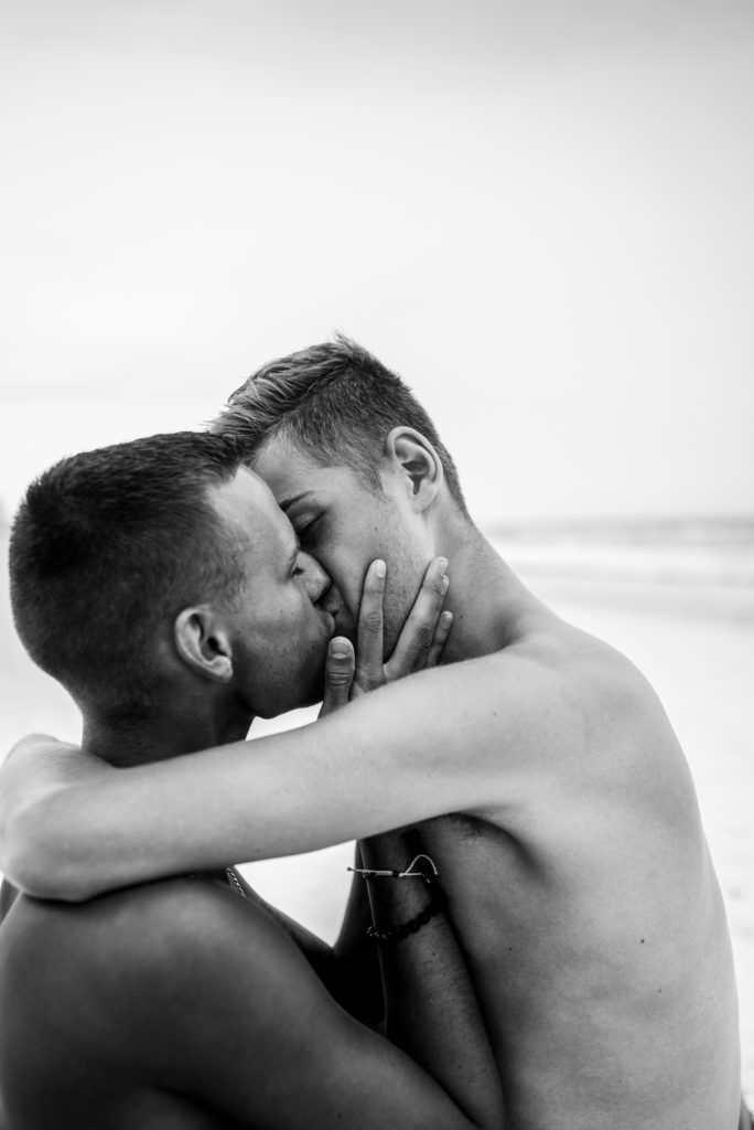 Cancun beach lovers shoot, kissing in black and white