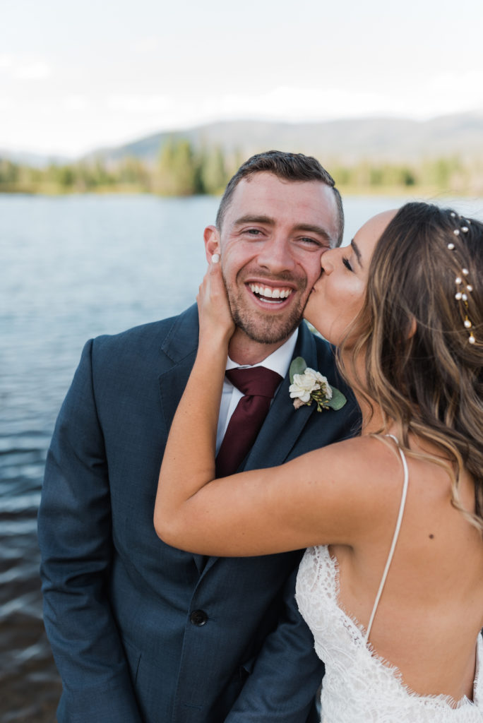 Kathryn kissing Phil at Grand Lake wedding