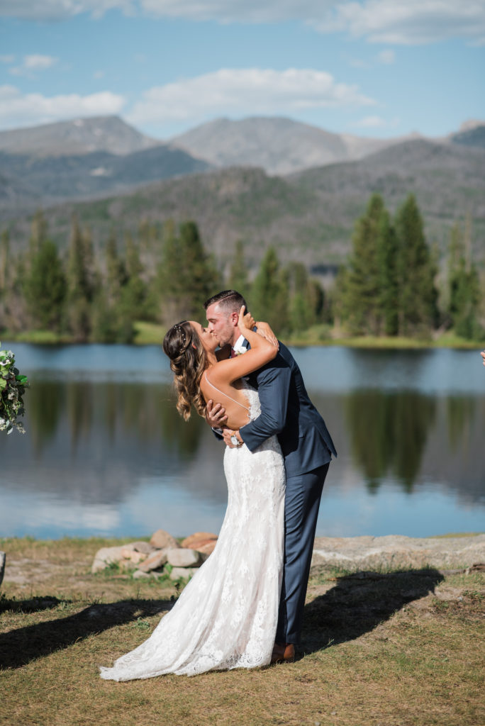 Kathryn and Phil kissing at Grand Lake Wedding