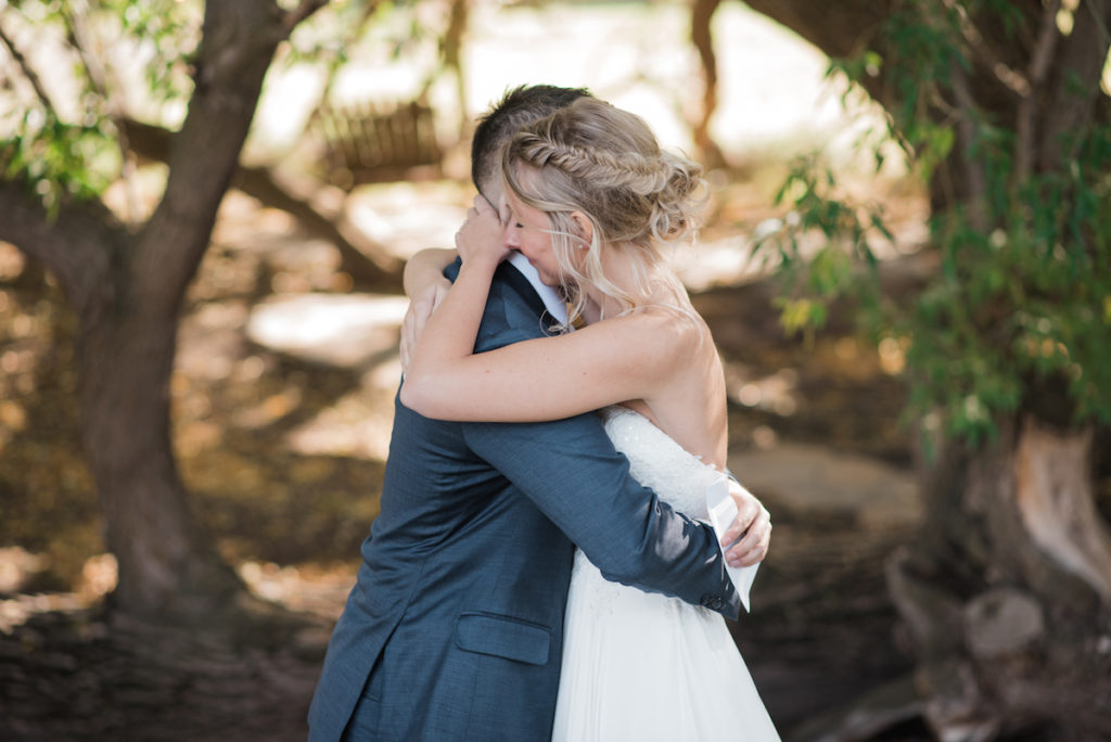 Emily and Andrew hugging at Heber City wedding