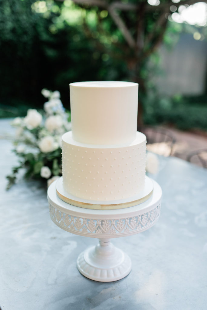 White wedding cake at luxury wedding
