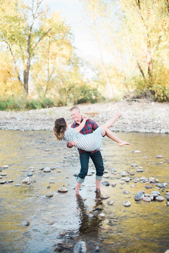 couple dancing in poudre river engagement photos