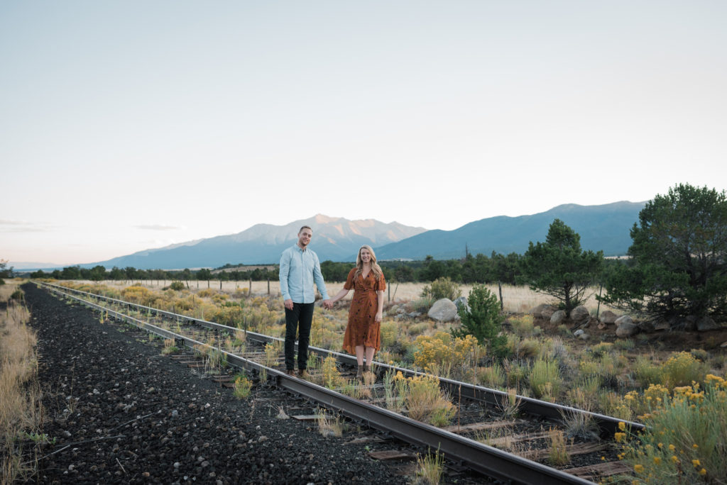 Buena Vista Engagement, couple railroad walking