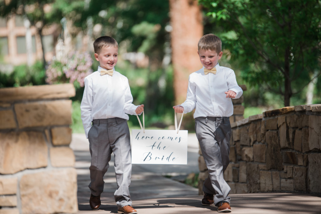 Kids bring sign down the aisle 