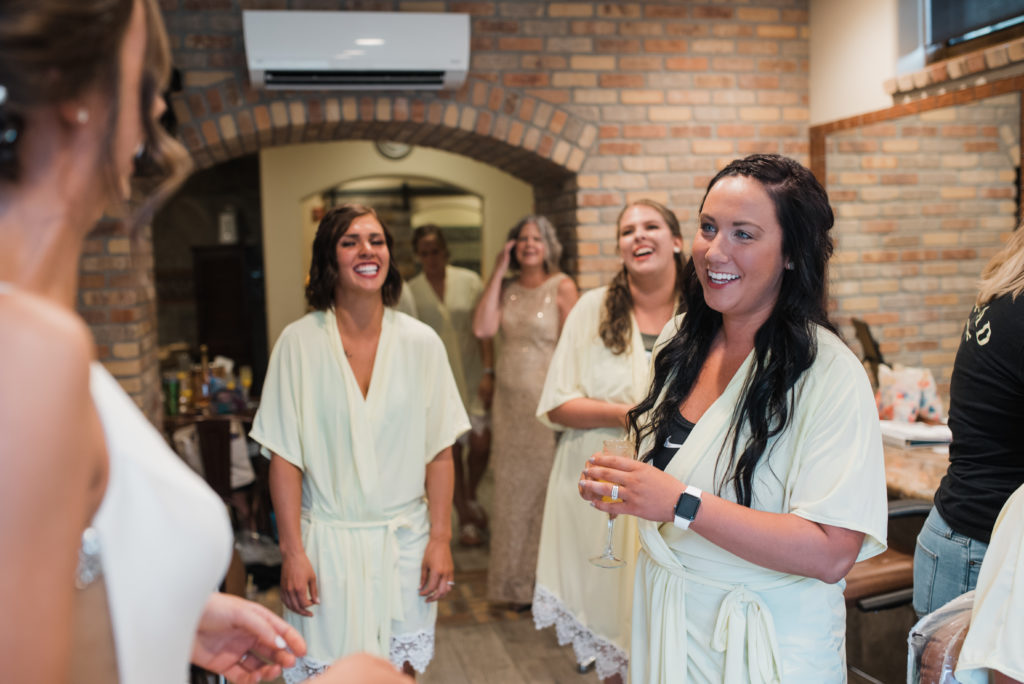Bridesmaids hanging out and laughing 