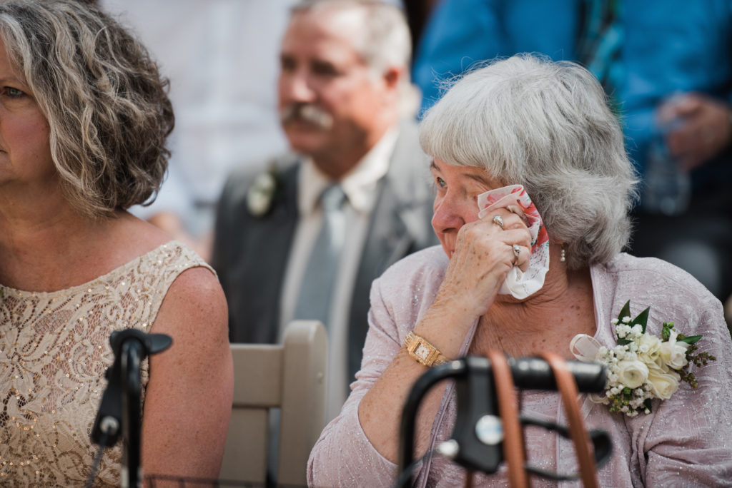 Grandma crying at ceremony 