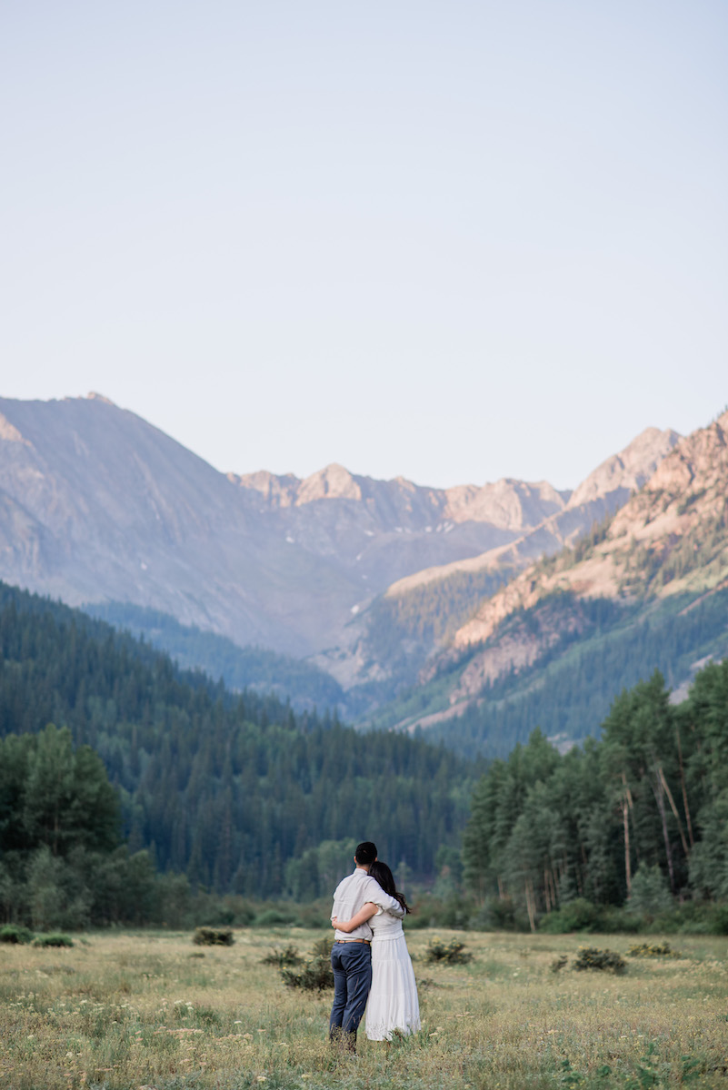 Couple looking at mountains at Aspen Engagement